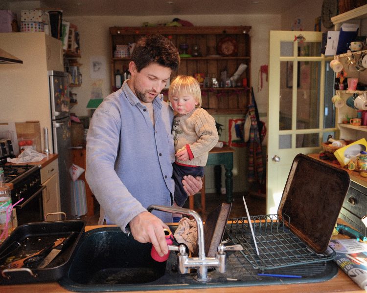 Father and son in the kitchen. Somerset, UK
