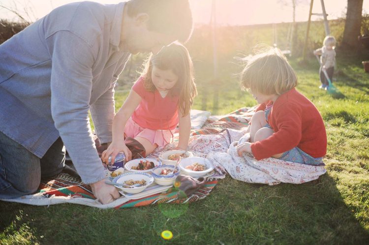 Family picnic in the garden. Somerset, UK